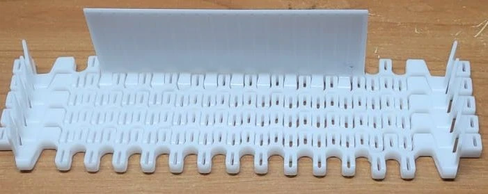 Modular Conveyor Belt ML101R POM (xx X xx mm, partition height H=xx mm, step xx mm, edge offset xx mm, SS pins, clips)