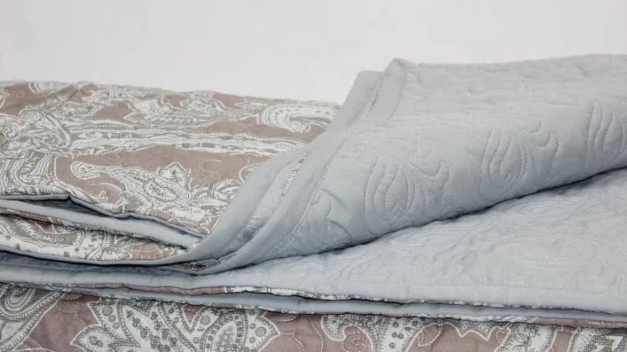 Quilted Bedspreads with Natural, Blended, and Synthetic Fabric Tops